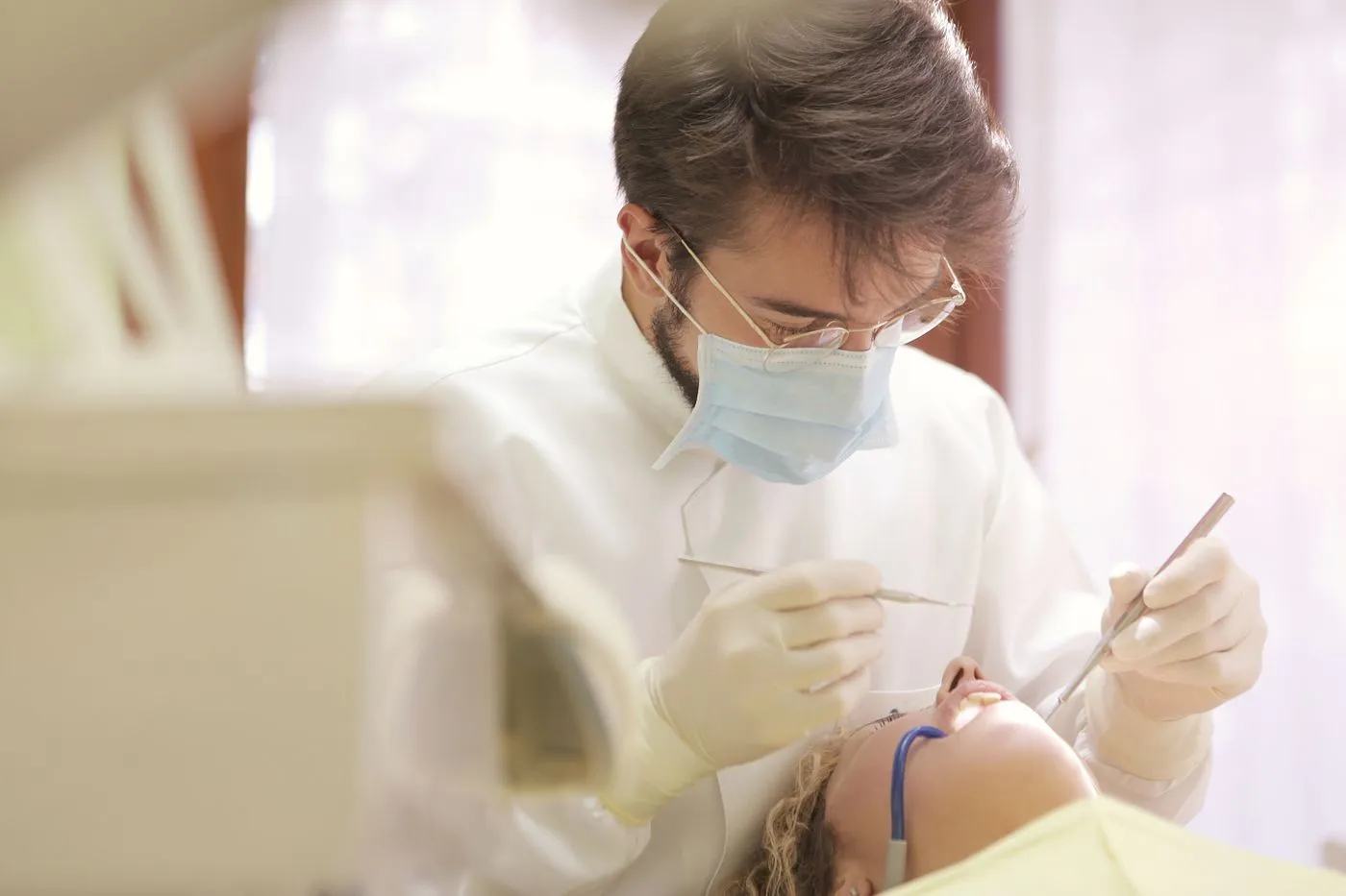 Dental professional preparing a comfortable treatment space