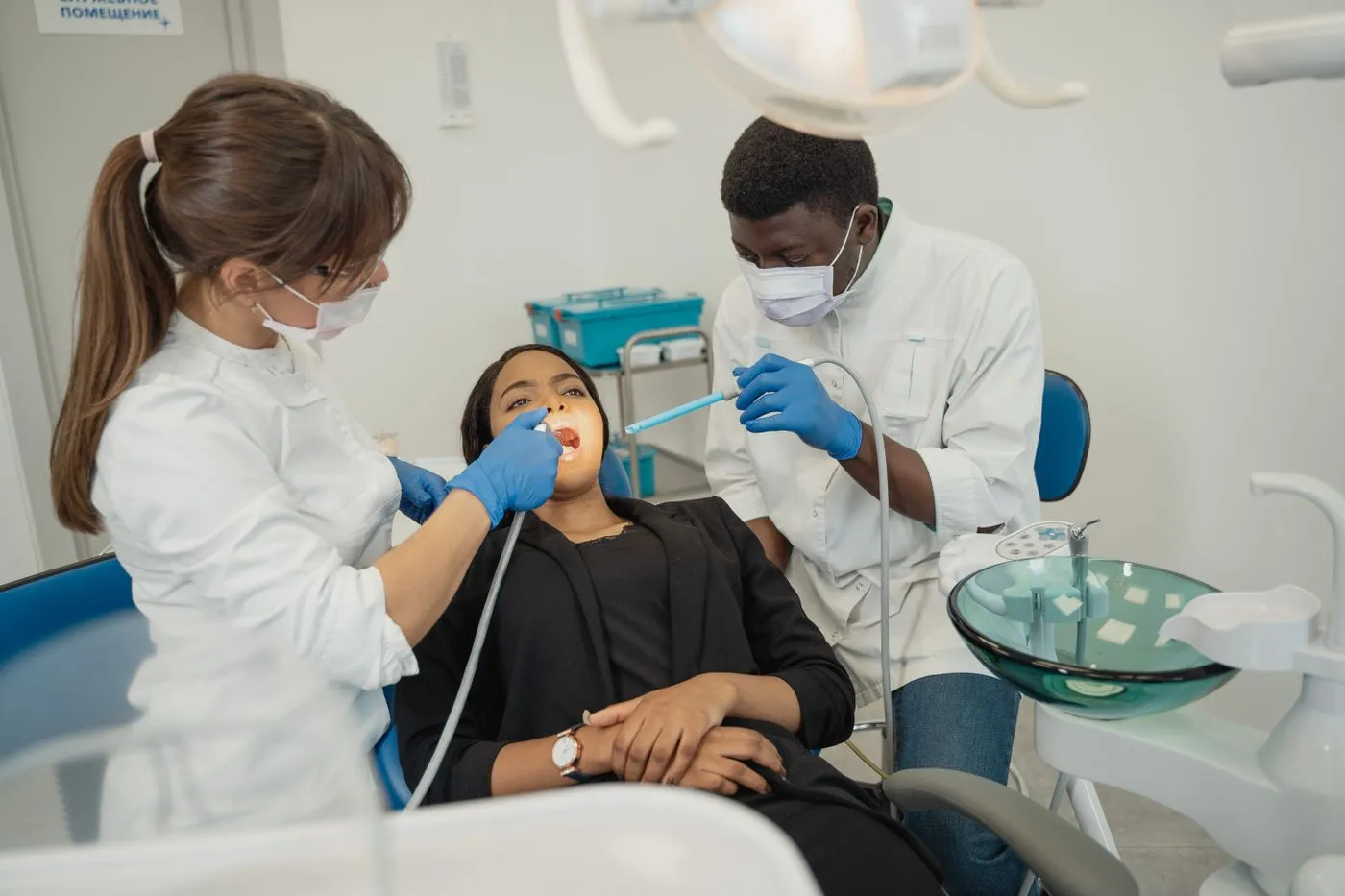Dental team member speaking reassuringly with a patient